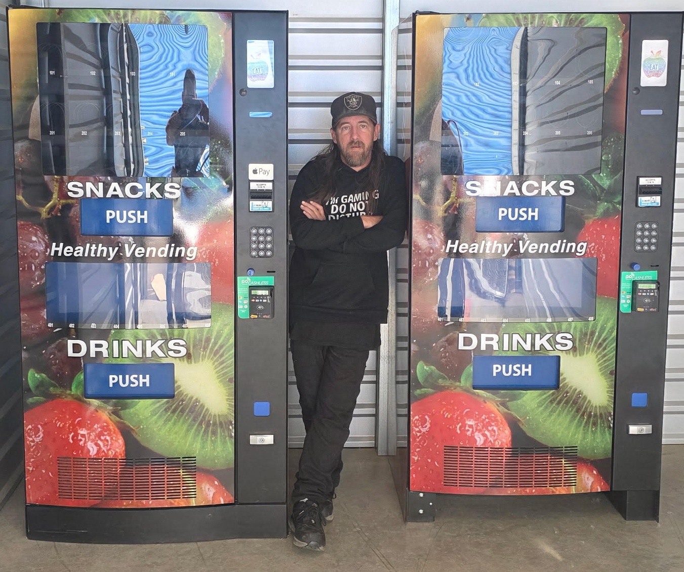 Two custom-wrapped Combined Multimedia Vending snack and drink machines